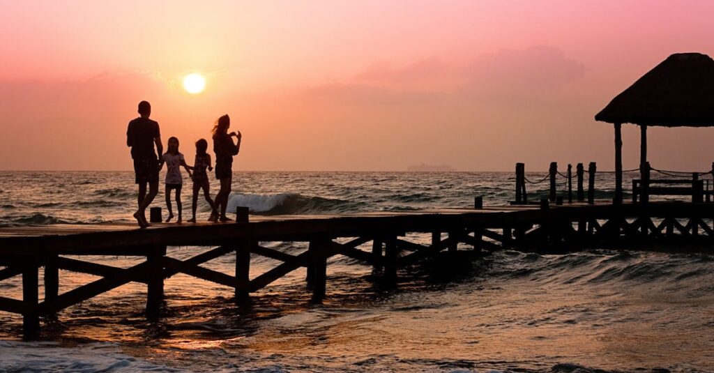 People Standing on Dock during Sunrise