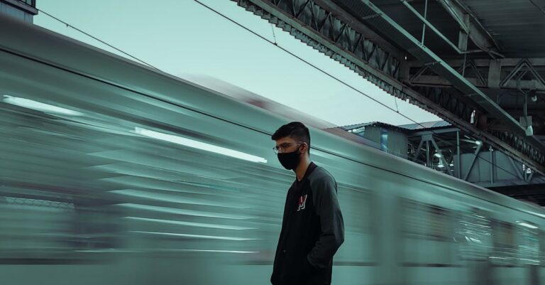 Man Standing in Train Station