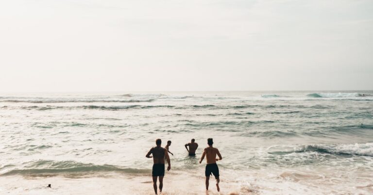 People Running Near Seashore at Daytime Photo