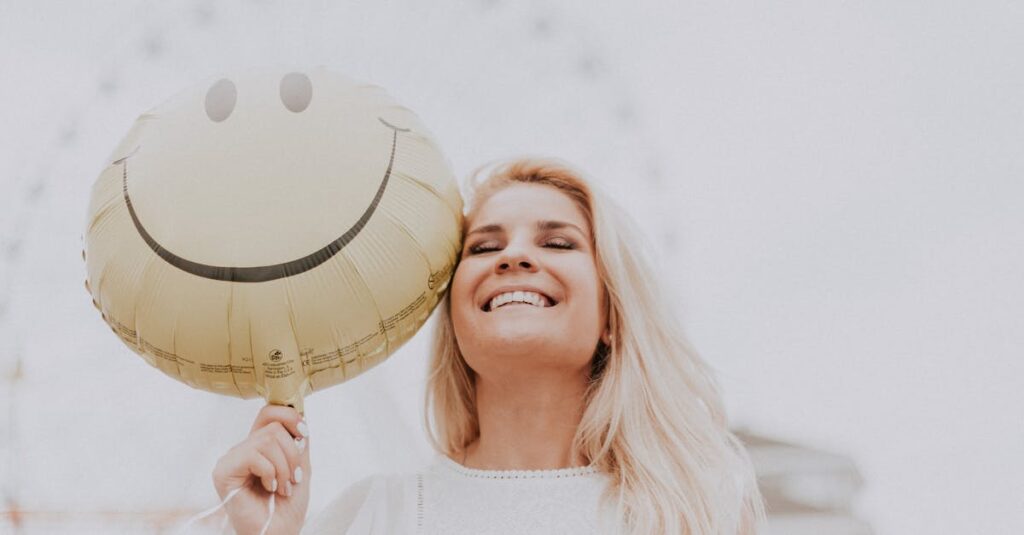 Woman Holding a Smiley Balloon