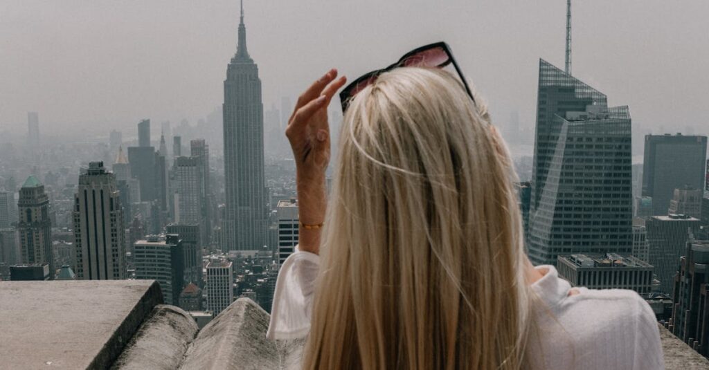 Woman Wearing White Shirt Standing Infront of City Building View