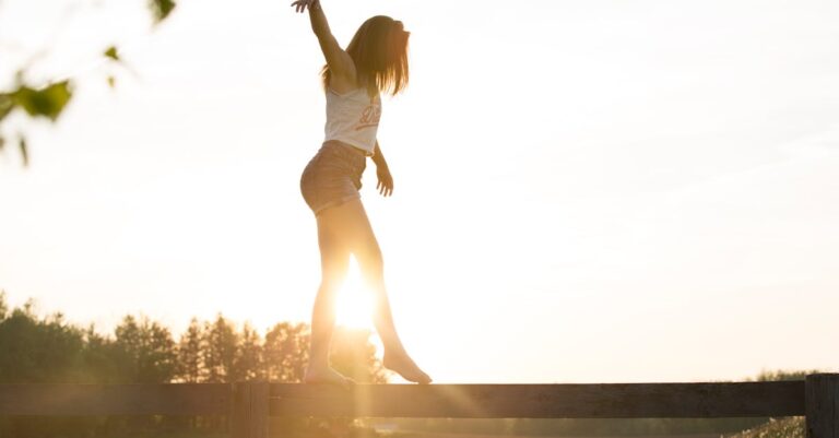 Woman Walking On Fence