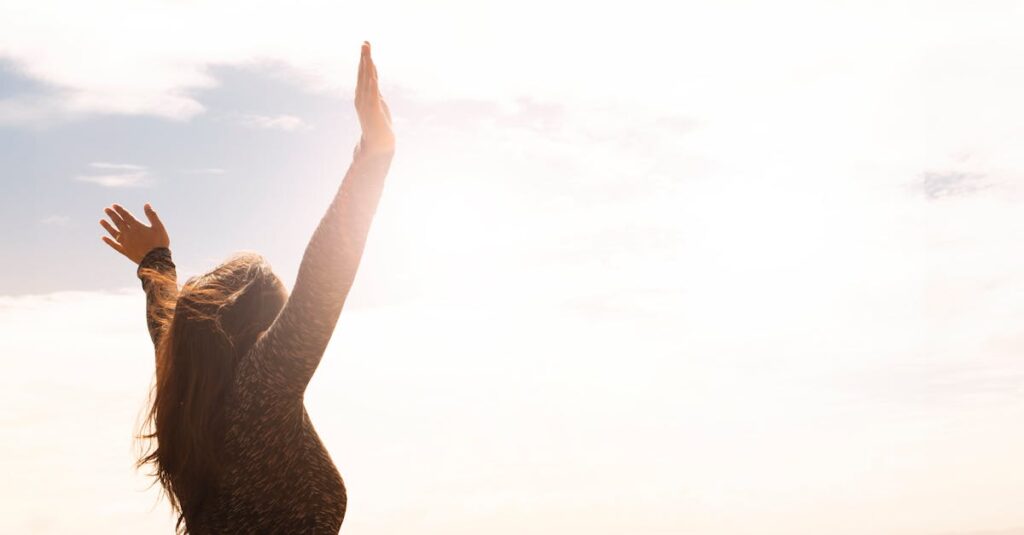 Photo of Woman Raising Both Hands