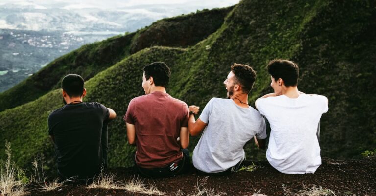 Four Men Sitting On Ground