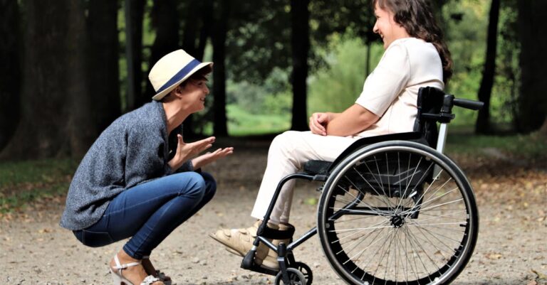 Woman on Black Folding Wheelchair