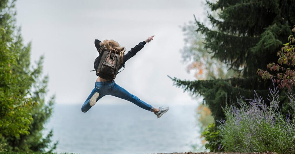 Woman Jumping Wearing Green Backpack