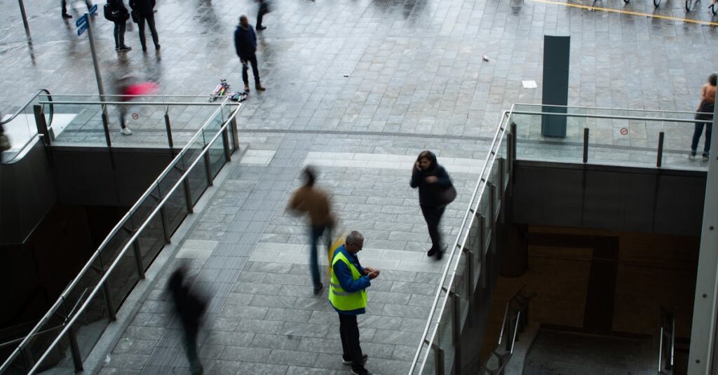 Man in Green Vest Standing on bridge