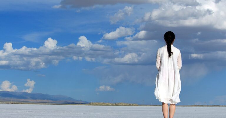 Woman With Umbrella on Beach