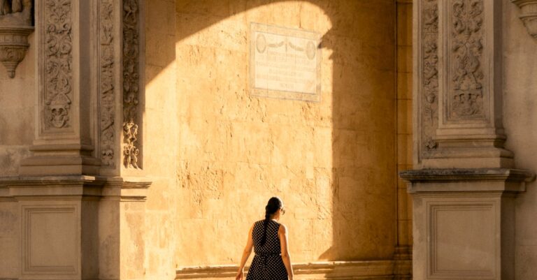 A Woman Walking Through a Historical Building