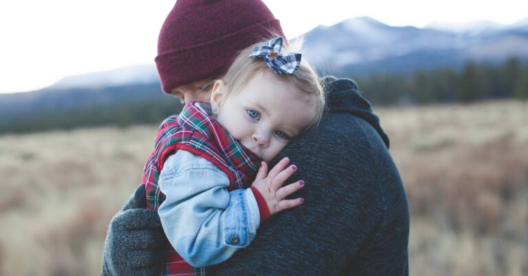 Man Carrying a Baby