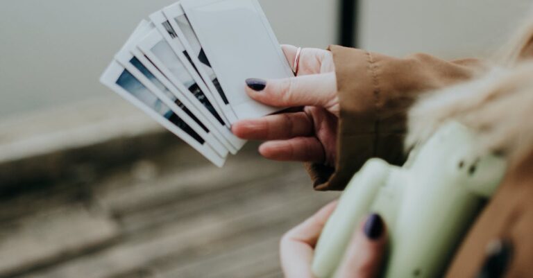 Person Holding a Polaroid Photos