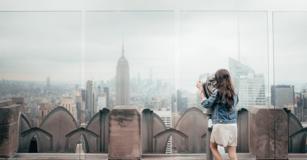 Woman In Blue Denim Jacket Standing On Top Of Building