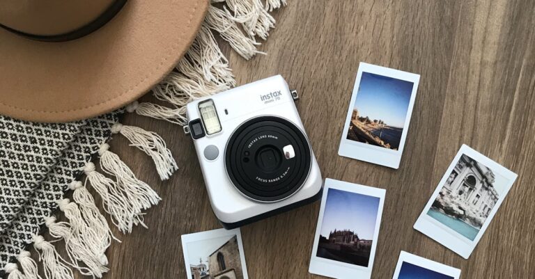 Instant Photos And Camera On Wooden Floor With Concept Of Travel