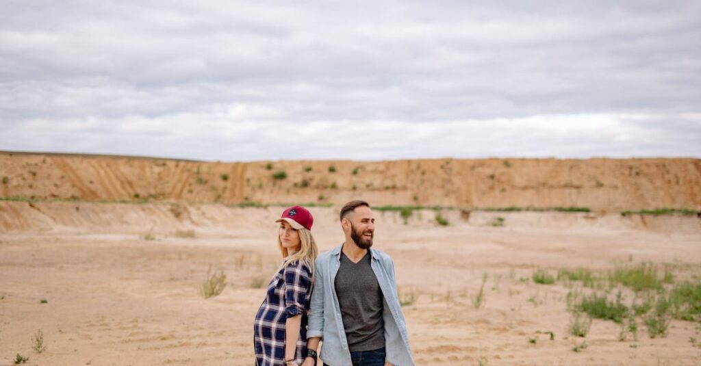 Happy Couple Standing on the Sand