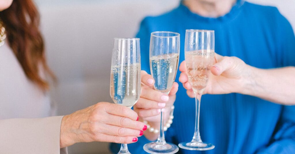 Senior women clinking glasses of champagne