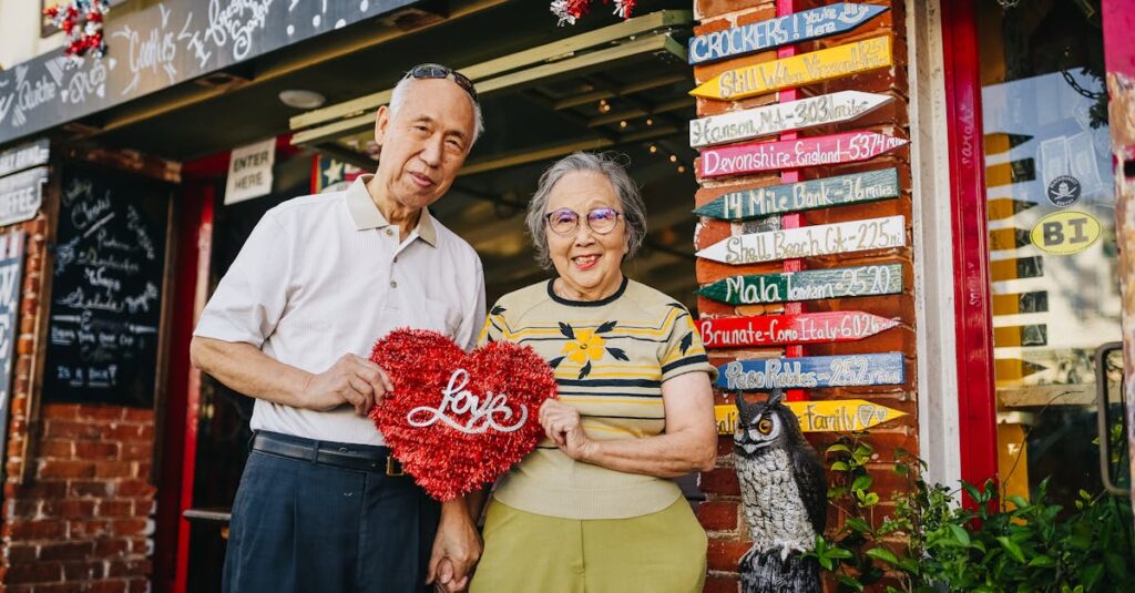 Elderly Couple Holding Red Heart