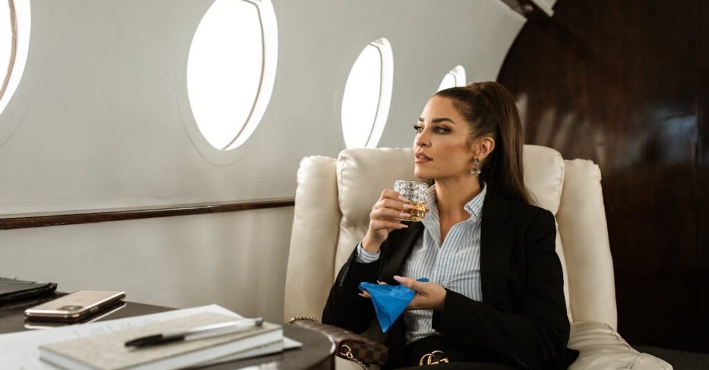 Businesswoman holding a Glass of Whiskey while on a Private Jet