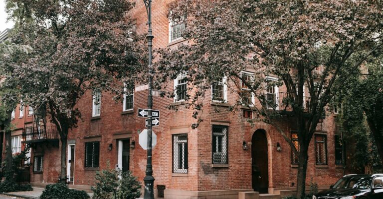 Brown Brick Building Near Green Trees