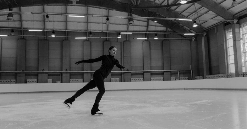 Man in Black Jacket and Pants Playing Basketball in Grayscale Photography