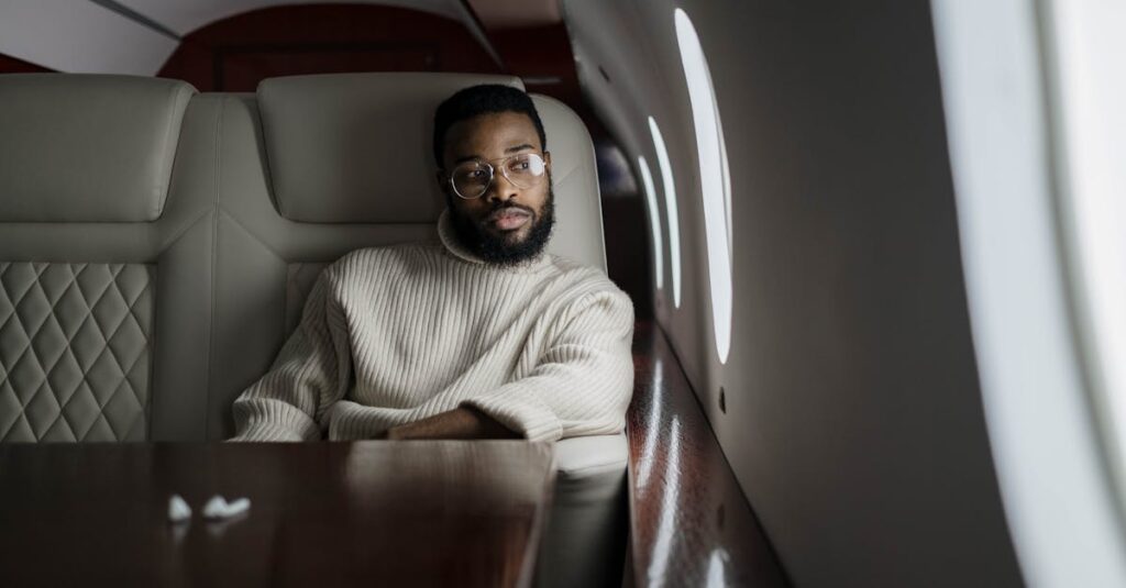 A Man Glancing Out the Airplane Window