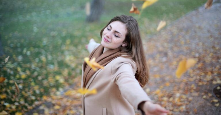 Woman Open Arms While Closed-eyes Smiling Photo