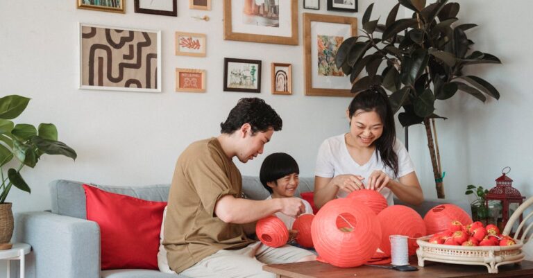 Family in an Interior with Pictures on a Wall Preparing Red Lantern Decoration