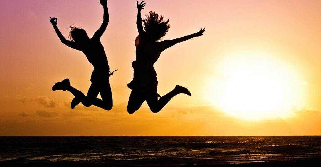 Silhouette Photography Of Jump Shot Of Two Persons