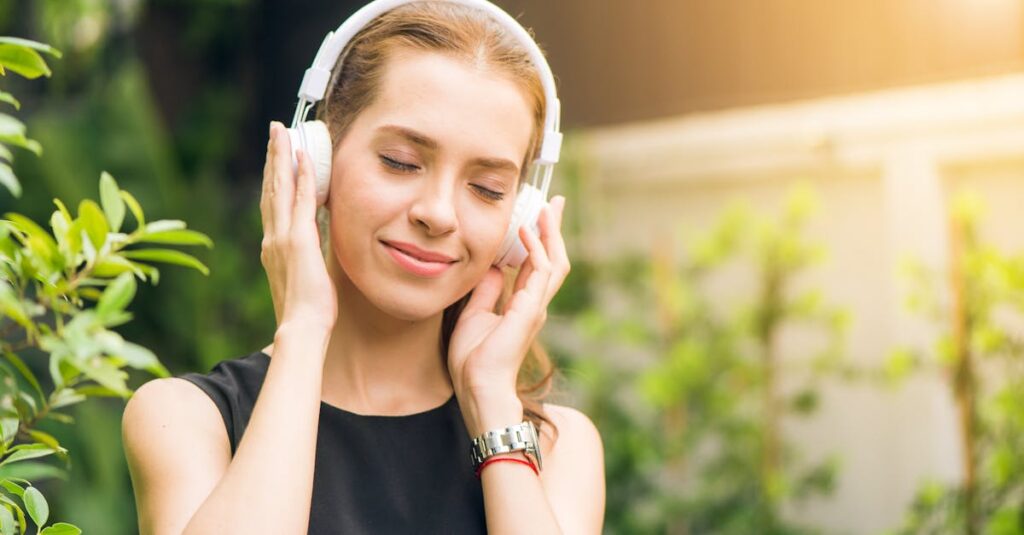 Woman Wearing Black Sleeveless Dress Holding White Headphone at Daytime