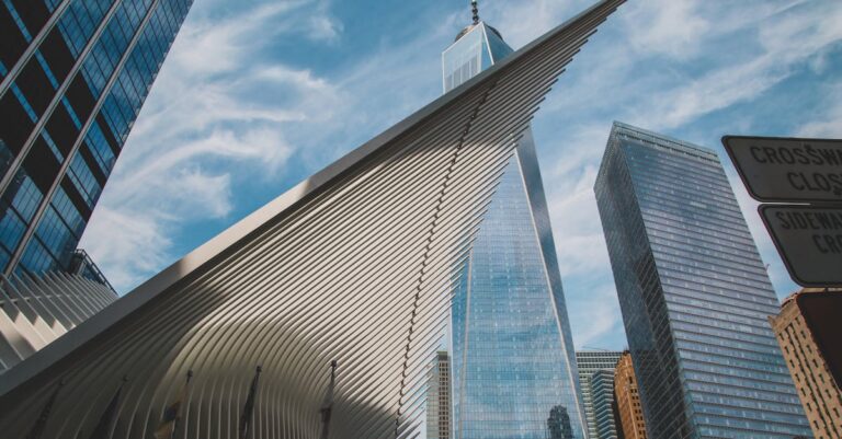 White and Blue Glass Building Under Blue Sky