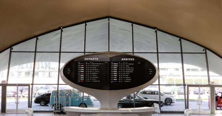 Screen with Departures and Arrivals at Airport in New York