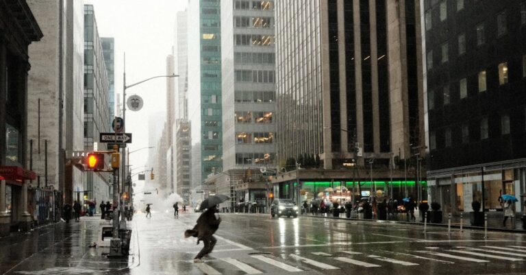 Person Crossing Street in New York in Rain