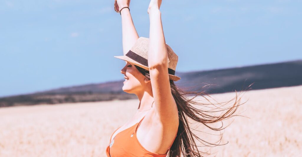 Photo of Woman Raising Her Both Arms