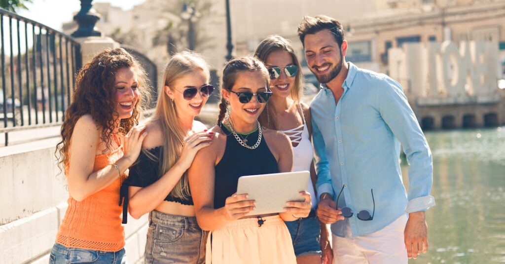 Group of People Standing Beside Body of Water