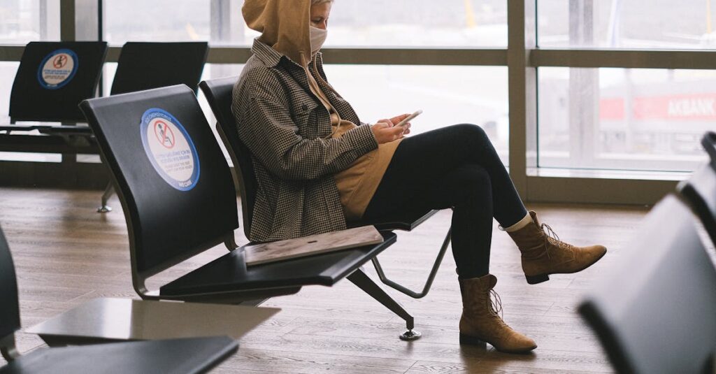 Woman Wearing a Hoodie Sitting on Chair