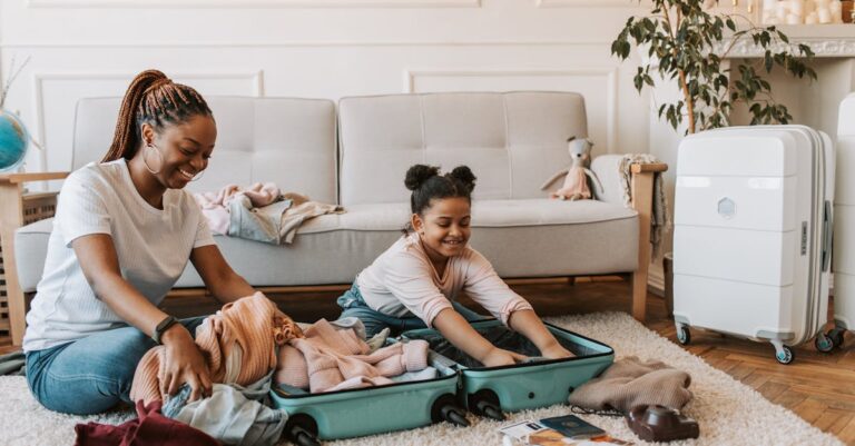 Woman and Child Packing Their Clothes