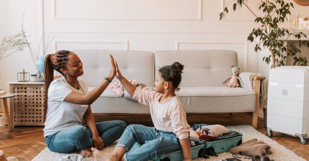 Mother and daughter Doing High Five