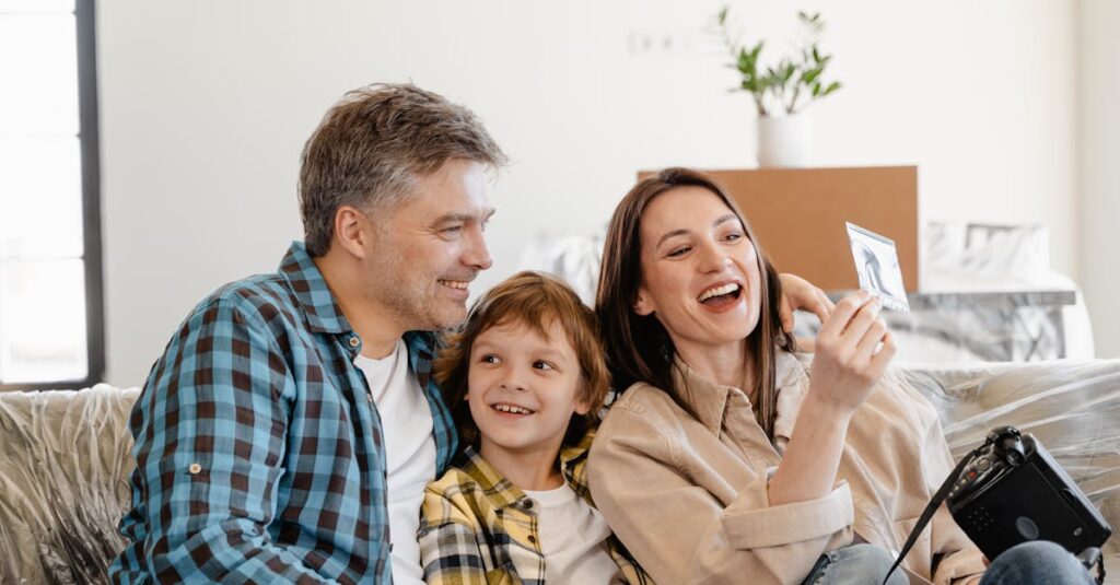 Man and Woman Smiling While Holding White Smartphone