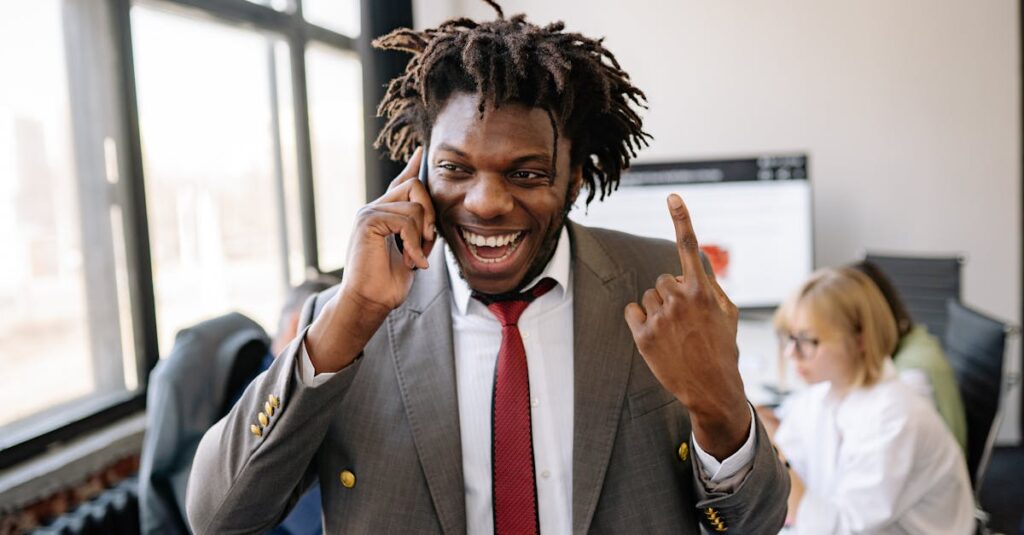 Happy Man in Gray Suit Jacket having a Phone Call