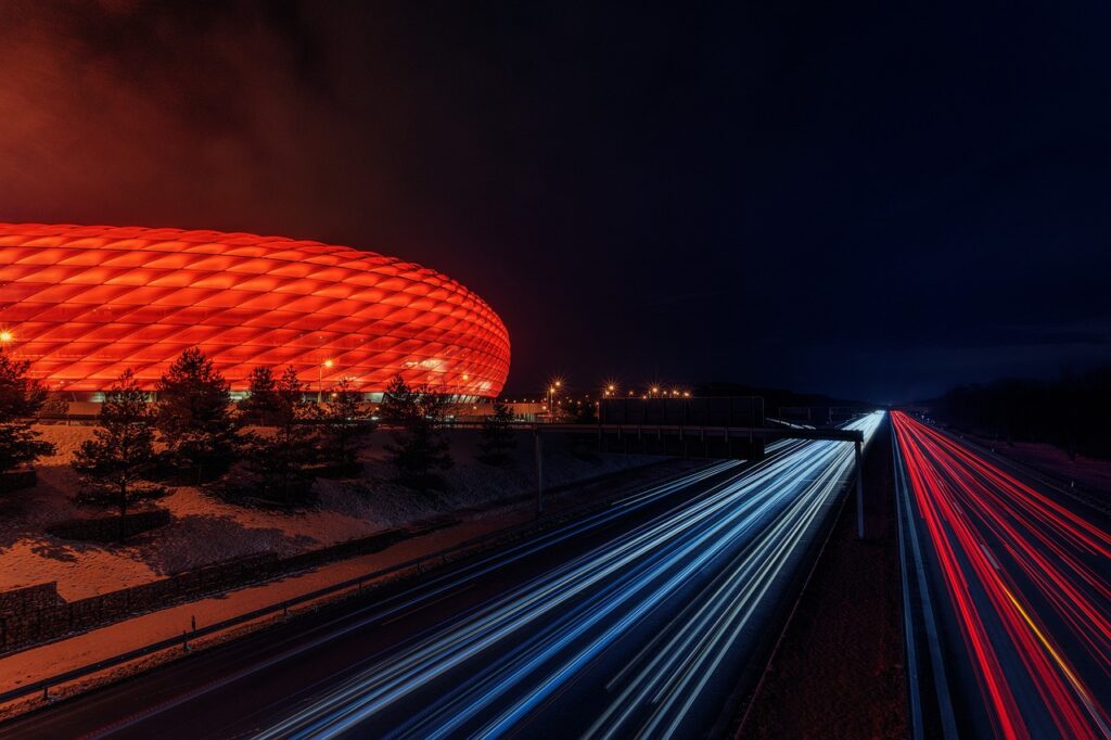 football stadium, highway, night