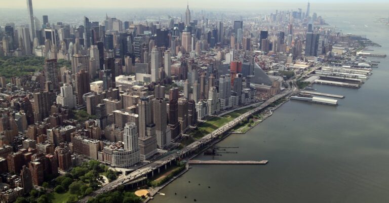 A captivating aerial view of the Manhattan skyline in New York City, showcasing the iconic architecture and urban landscape.