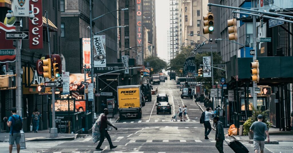 A lively New York City street scene with pedestrians crossing and iconic buildings.