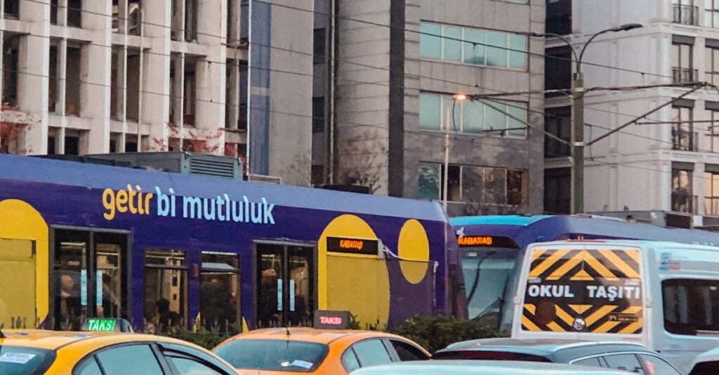 Istanbul street scene with cars, tram, and vibrant urban life captured in bustling traffic.