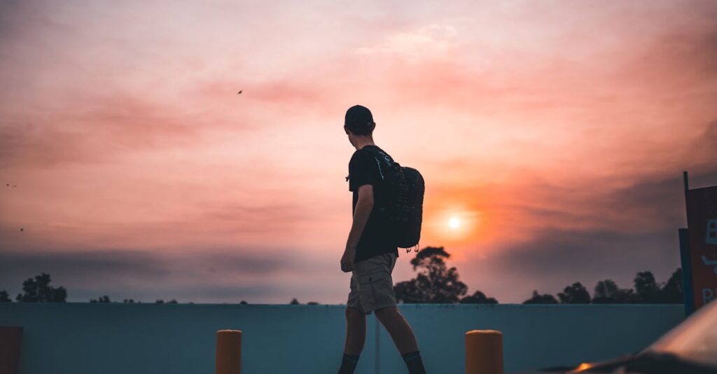 Man Walking on Metal Pipe Near the Road