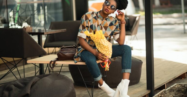 Trendy woman with sunglasses and flowers relaxing on a patio bench in sunlight.