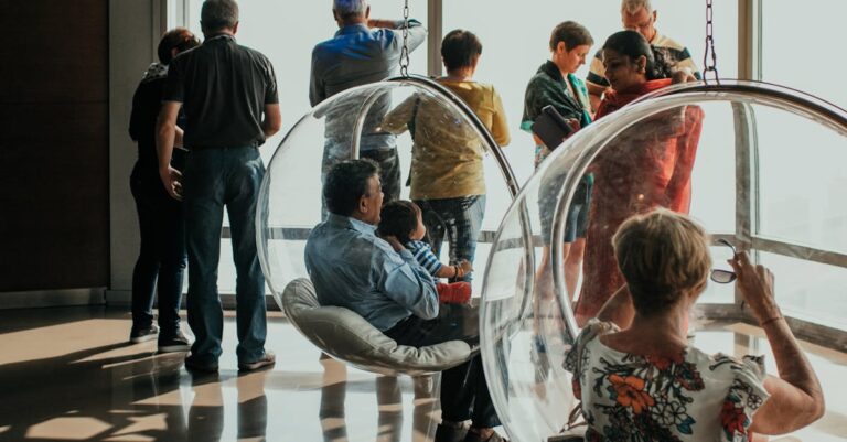 Group of people viewing a city skyline from an observation deck in Dubai, UAE.