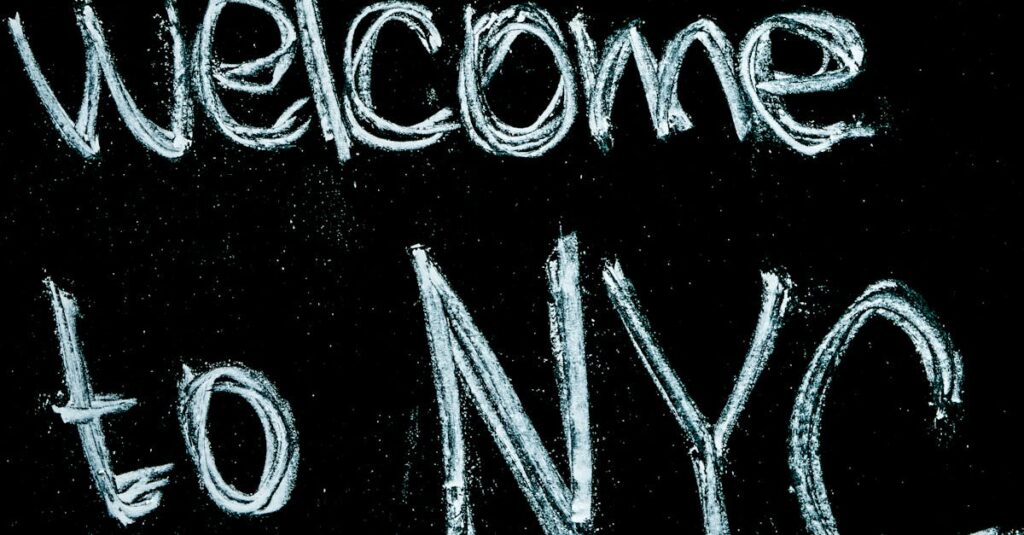 Close-up of a chalkboard with 'Welcome to NYC' handwritten in chalk, offering a warm invitation.