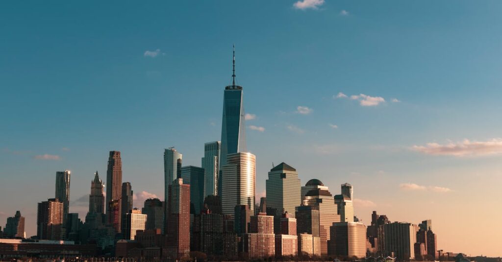 Stunning view of New York City skyline during sunset, highlighting iconic skyscrapers.