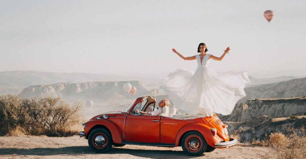 Bride and groom celebrating their wedding atop a vintage car in Cappadocia, Turkey.