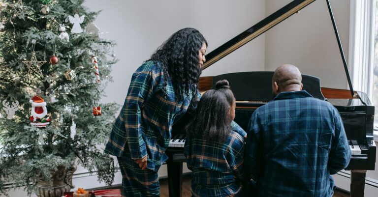 Back view of anonymous African American family playing musical instrument in cozy room with decorated Christmas tree