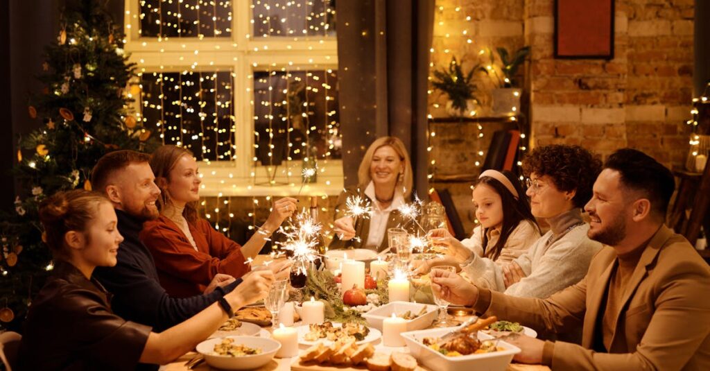 Family celebrating Christmas with dinner and sparklers, creating joyful holiday atmosphere indoors.